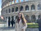 Admiring the Colosseum on my first day in Rome