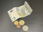 Here are some Euros. The size of the bills changes too, so a 10 euro bill is bigger than this 5 euro one!