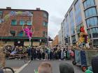 A woman doing aerial hoop in the parade, I would be scared if I was her
