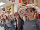 Alia, Claire, and I found matching hats in a charity shop