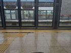 Waiting at the subway on a rainy day