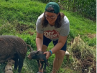 holding a baby pig