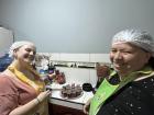 My host mom and another volunteer making the mousse
