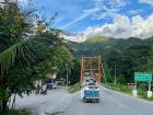 This is a mototaxi crossing the river as the sun sets in the Peruvian jungle.