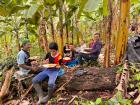 Host family eats lunch in the chacra