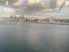 The skyline of Auckland from a bus - can you see the bridge reflection in the window?