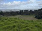 If you look closely, you can see that all the white dots in the field below are sheep!