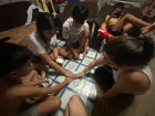 Neil and the neighbors playing a "filipino" card game 