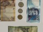 Peruvian money featuring various bills and coins