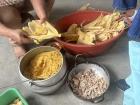 Here you can see my family preparing tamales! Another popular food here made of corn.