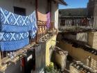 Another view of her home. Here you can see they hang their laundry out to dry because that sun is very strong.