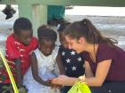One of the nurses interacting with some Haitian children