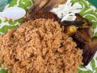 Yumm, jollof rice with chicken and fried plantains