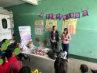 A photo of me and my socia (work partner) talking to a group of breastfeeding mothers during the club de madres lactantes (breastfeeding mothers' club)