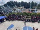 A good view of parents and other community members waiting in the town square for the kids' parades to pass through