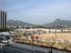This is central Seoul. You can see the mountains in the background and the traditional building surrounded by the modern buildings. 