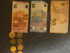 This displays a few of the kinds of Euros, both the paper bills and the coins