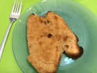 Milanesa is flat, breaded chicken (or beef) served with lemon juice on top