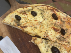 Pizza is very common with olives because they grow a lot of them!
