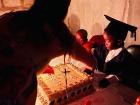 Cutting cake with a preschool graduate