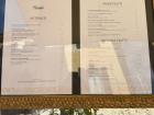 Menus are usually outside by the seating so customers can see what is available before sitting.