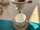 Pour over coffee, coffee grounds above an empty mug