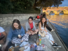 My friends and I having a picnic along the Seine