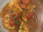 A traditional meal of ravioli stuffed with sheep's ricotta and served with fresh tomato sauce and basil