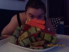 Mikayla posing with a pile of fresh watermelon!