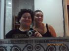 Arden and Mikayla smiling in their bathroom mirror