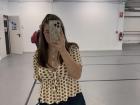 Mikayla standing in her class with a cute outfit