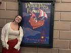 Peter Pan is my favorite movie and I'm standing in front of the poster for the ride!