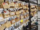 A rack to tie bad fortune and Ema (wooden plaques to write wishes and prayers on)