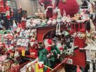 A large collection of Santas and reindeer inside of a train