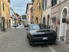 An American muscle car spotted in Italy; a rare sight among Europe’s compact city cars