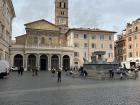 A lively square that feels like a small village filled with music conversation and classic Roman charm