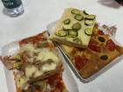 Many different kinds of pizza from a market