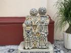 These concrete figures in front of the Santiago parish celebrate the importance of family