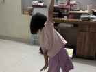 A kid watching a video and dancing along while they practice new moves