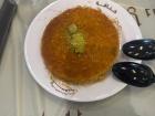 Kunafah is a traditional Middle Eastern dessert made with sweet cheese and a sugar syrup