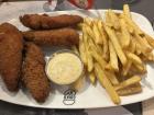 A very classic meal of fries and tenders. There's so many condiments here!