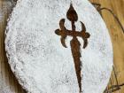 This is an almond-based cake from Galicia, Spain, traditionally covered in powered sugar to form the image of a sword--it has its roots in the medieval times 