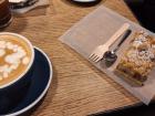 Cappuccino and apple crumble at a cafe 