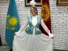 Trying on Kazakh traditional clothing at the Kazakh Peoples' Center in Bishkek