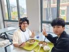 Perry and I eating the 辣肉湯 (spicy broth) or spicy meat soup