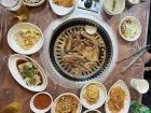 Korean barbeque with many side dishes or 반찬 (banchan)