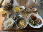 A traditional Korean lunch with grilled meat, soup and plenty of side dishes