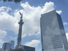 The Angel of Independence stands tall beside global offices such as HSBC, symbolizing how Mexico City blends local heritage with an internationally connected workforce shaping careers