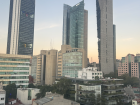 The early morning view from my apartment, with the BBVA Tower glowing as the sun rises over Mexico City