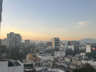 Watching Mexico City wake up as the sun rises over the skyline from my apartment window